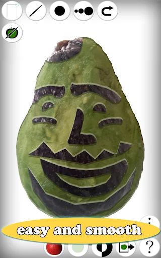 Fruit Draw app screenshot: Green pear with smiling carved face, drawing tools toolbar with pencil and shape options, easy and smooth interface
