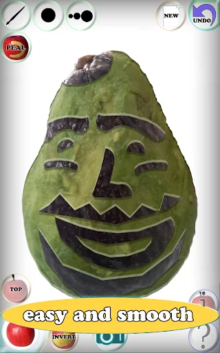 Fruit Draw app screenshot: Green pear with smiling carved expression, full toolbar with NEW, UNDO buttons and color palette for fruit sculpting