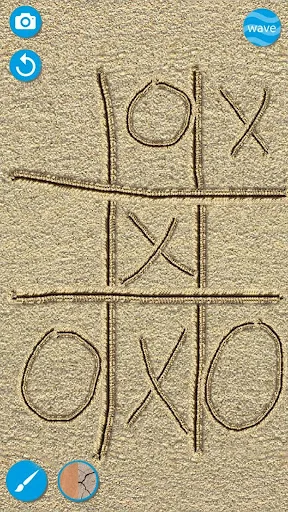 Tic-tac-toe game board drawn in sand with X and O symbols using Sand Draw creative art drawing tools